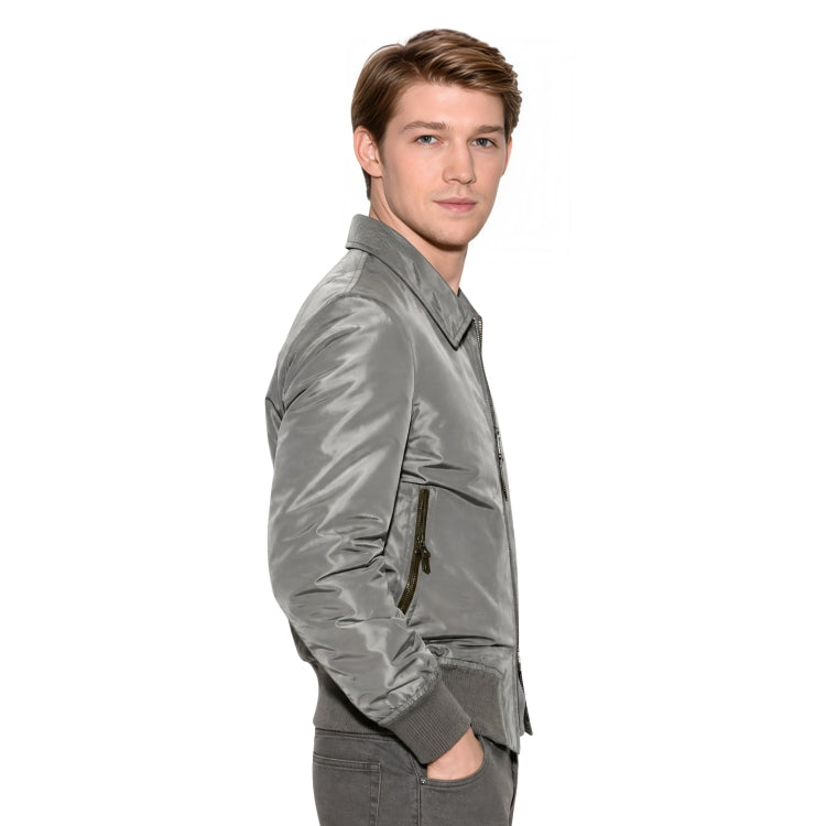 Person wearing a grey bomber jacket 