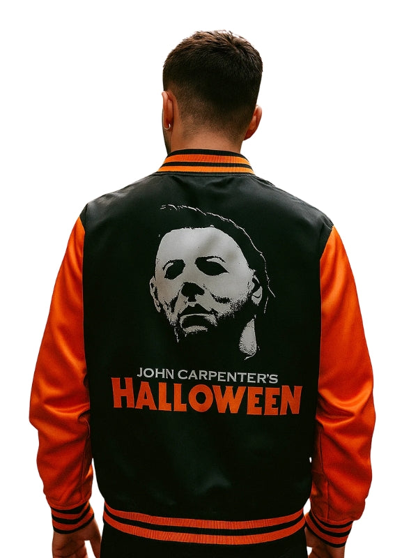 Person wearing a black and orange jacket with 'John Carpenter's Halloween' design on the back.