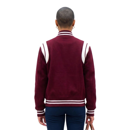 Person wearing a maroon varsity jacket with white stripes on a white background