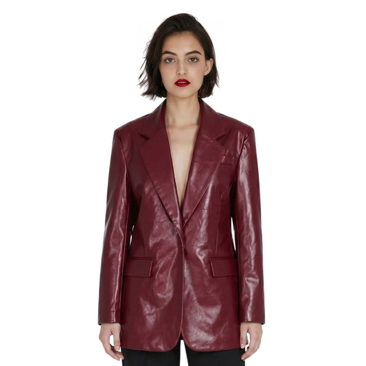 Woman wearing a burgundy leather jacket on a white background