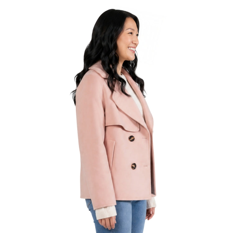 Person wearing a pink pea coat side ways 