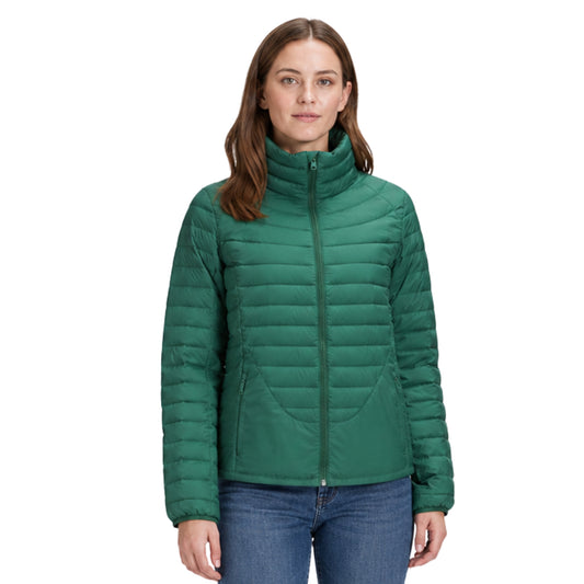 Woman wearing a green puffer jacket on a white background