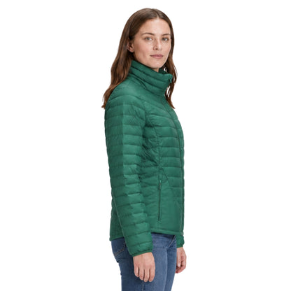 Woman wearing a green puffer jacket on a white background