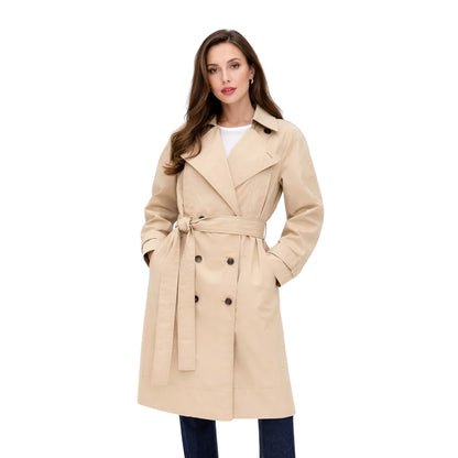 Woman wearing a beige trench coat on a white background