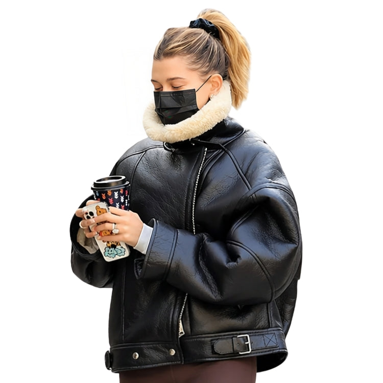 Person wearing a black leather jacket with a white fur collar, holding a Starbucks cup.