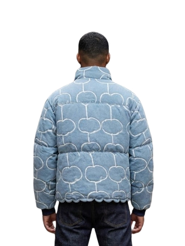 Person wearing a blue patterned jacket on a white background