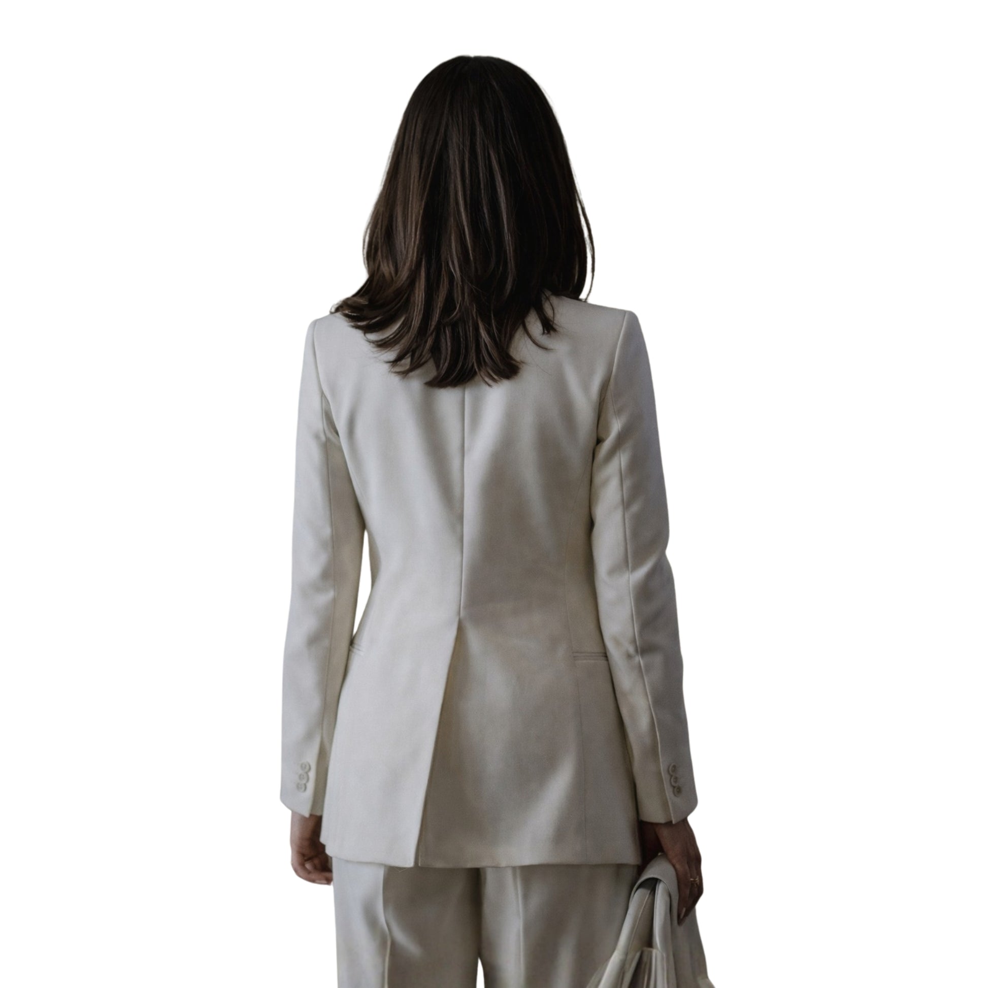 Woman wearing a beige suit on a white background