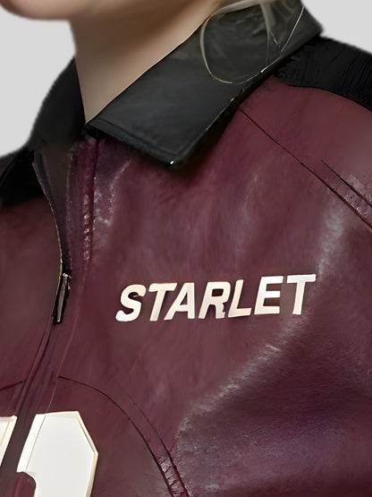 Close-up of a maroon jacket with 'STARLET' branding on a neutral background