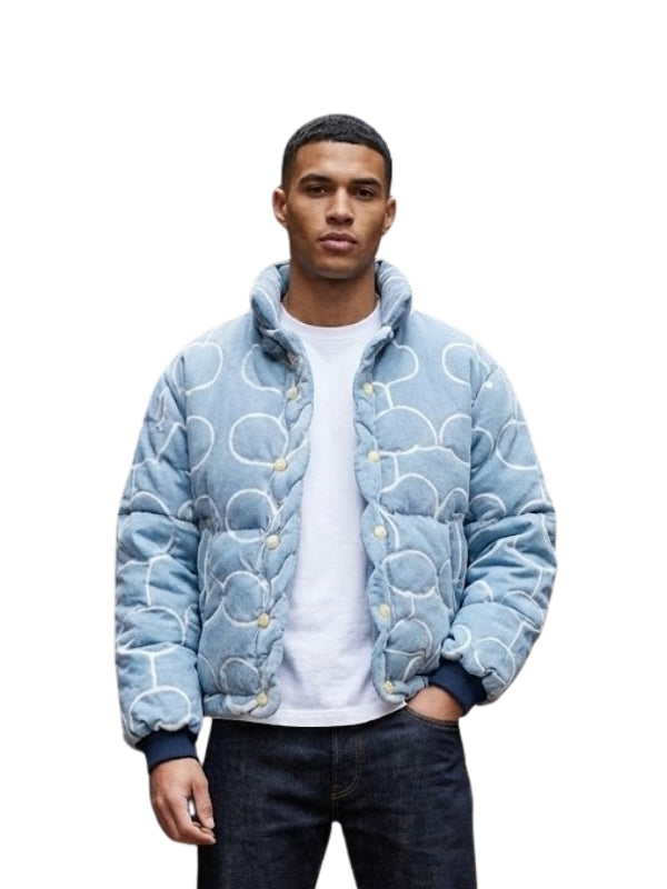 Person wearing a blue patterned jacket on a white background