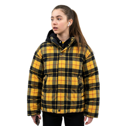 Person wearing a yellow and black plaid jacket on a white background