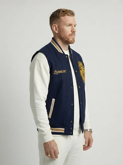 Man wearing a navy and white varsity jacket with 'Lionheart' branding on a light gray background