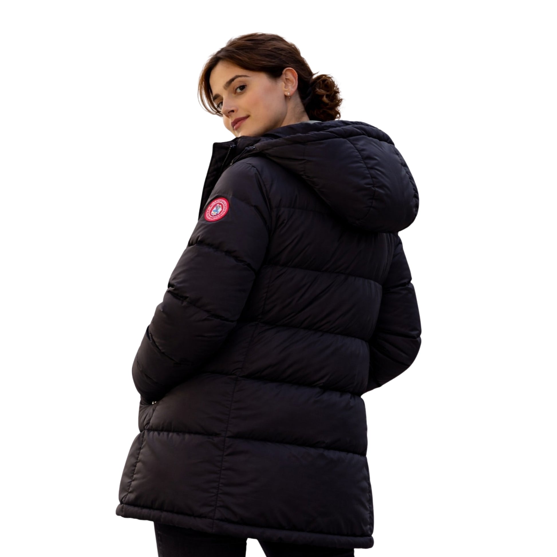 Person wearing a black puffer jacket with a visible brand logo on a white background