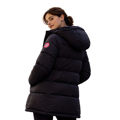 Person wearing a black puffer jacket with a visible brand logo on a white background