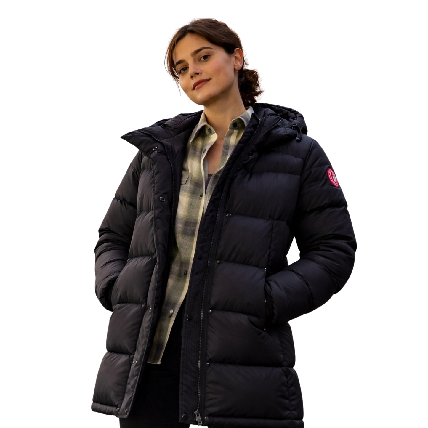 Woman wearing a black puffer jacket on a white background