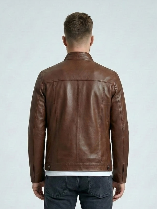 Man wearing a brown leather jacket on a light gray background