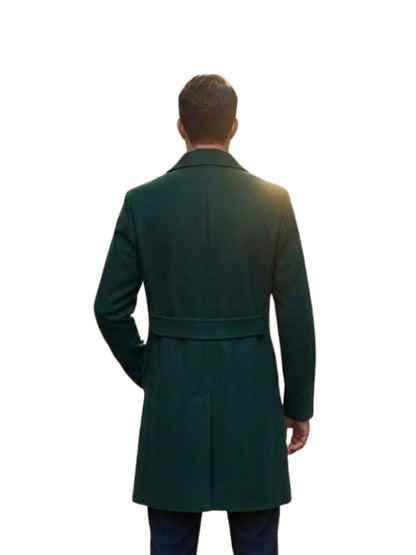 Man wearing a green overcoat from behind on a white background