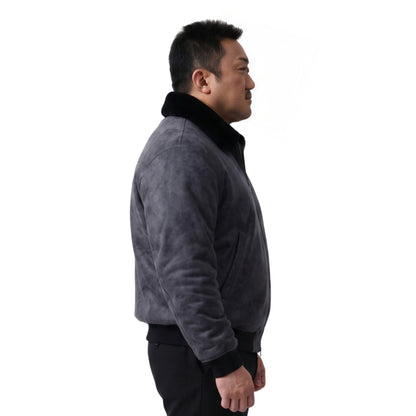 person wearing black jacket standing in sided pose 
