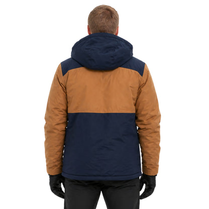 Person wearing a two-tone brown and navy jacket on a white background