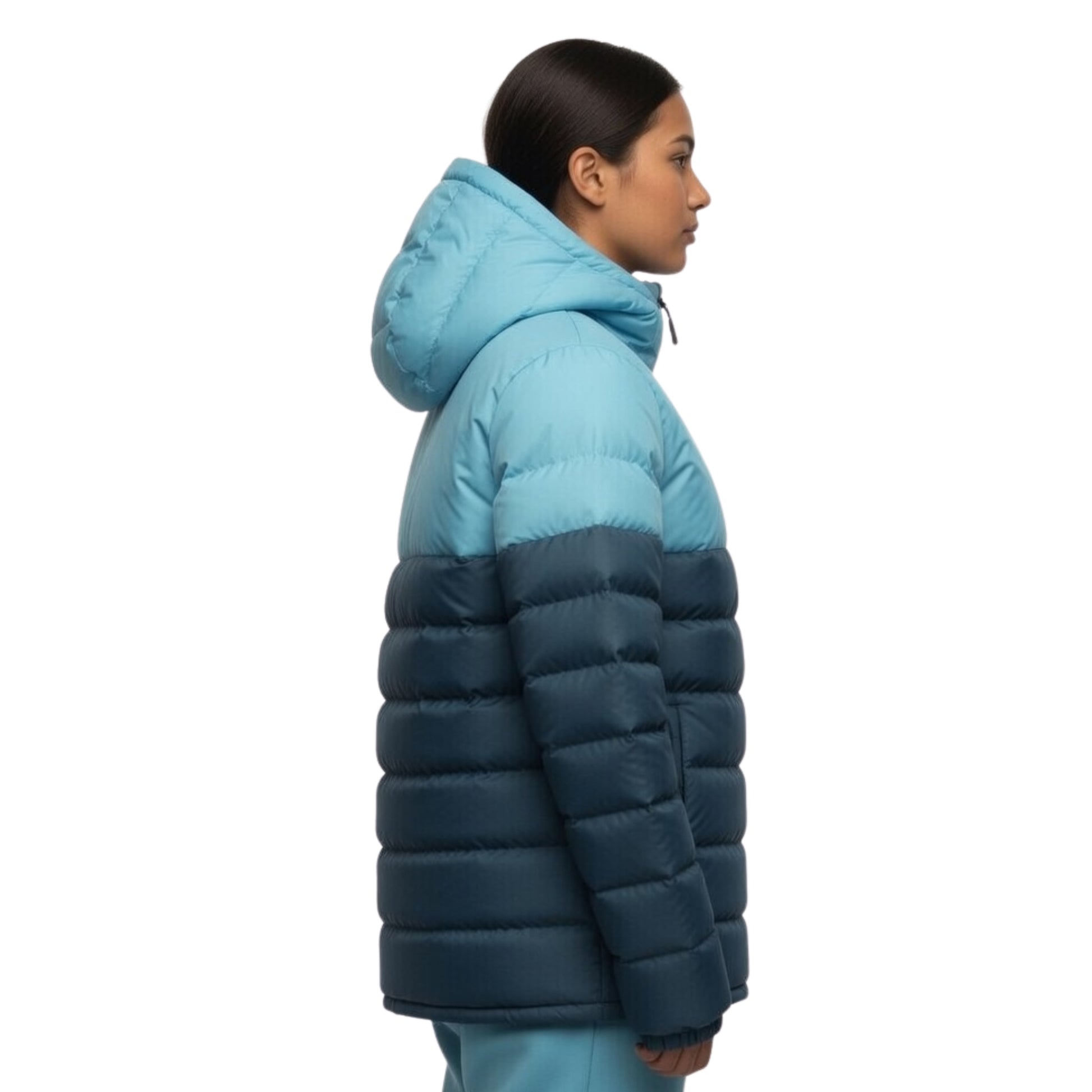 Person wearing a two-tone blue puffer jacket on a white background