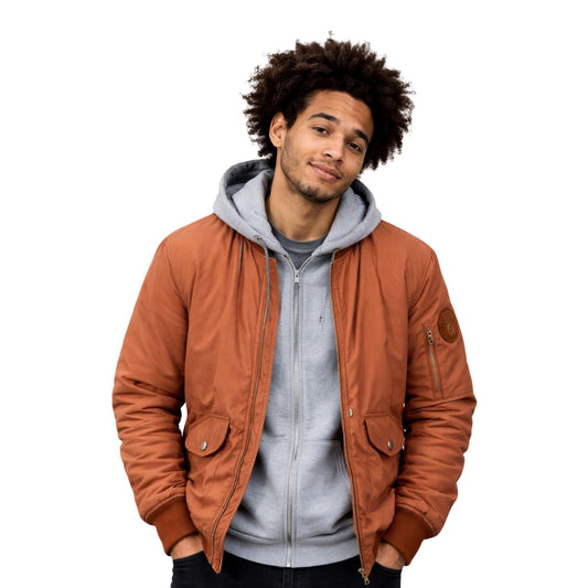 Man wearing a brown jacket over a gray hoodie on a white background