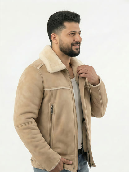 Man wearing a beige shearling jacket on a white background