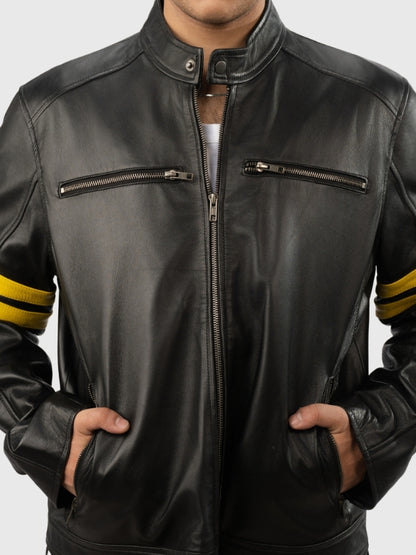 Black leather jacket with yellow accents on sleeves against a gray background