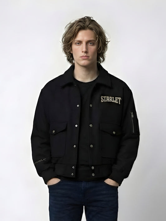 Person wearing a black jacket with 'STARLET' branding on a white background