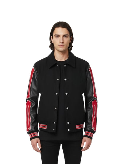 Man wearing a black jacket with red accents on a white background