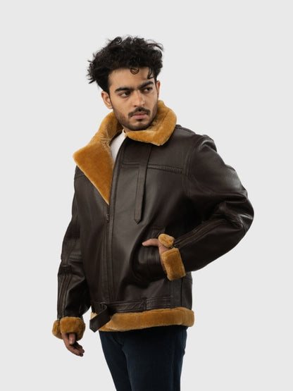Man wearing a brown leather jacket with fur trim on a white background