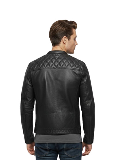 Man wearing a black leather jacket with quilted design on a white background
