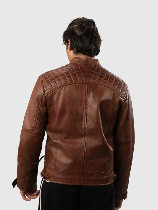 Brown leather jacket with quilted back design on a white background