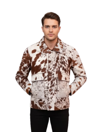 Man wearing a brown and white cow print jacket on a white background