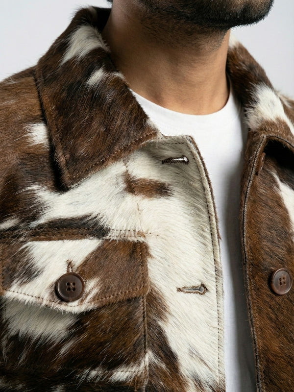 Close-up of a brown and white fur jacket with a neutral background
