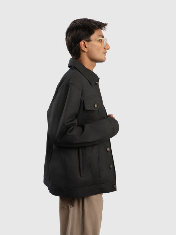 Person wearing a black coat on a white background