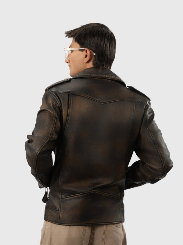 Person wearing a brown leather jacket on a light gray background
