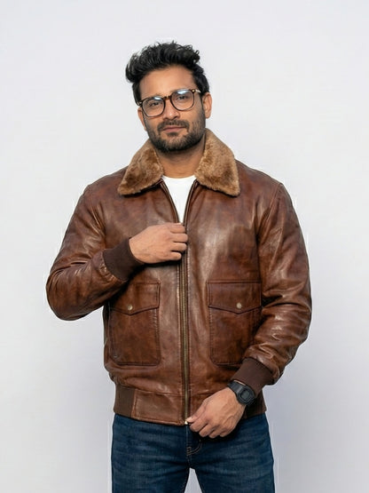 Man wearing a brown leather jacket with fur collar on a white background