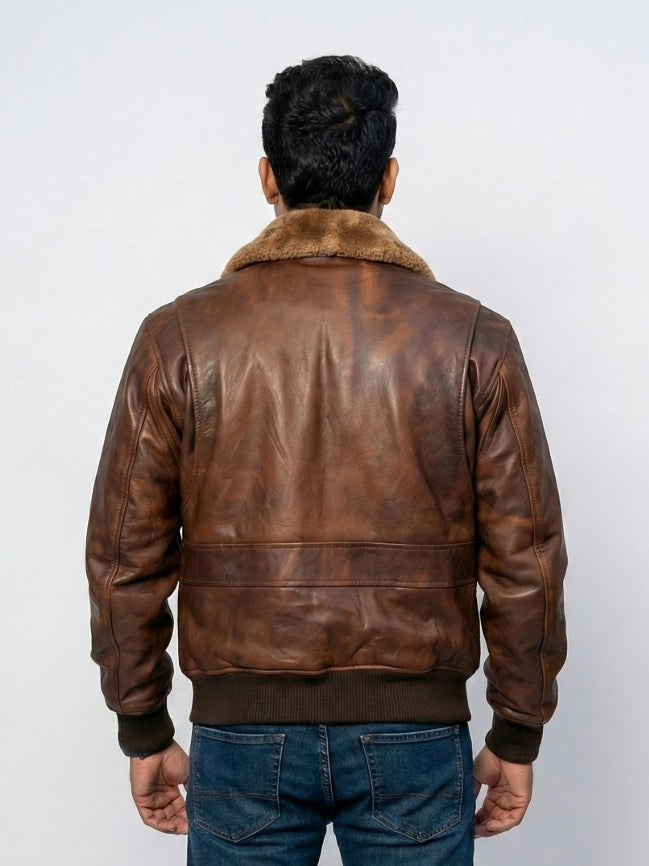 Man wearing a brown leather jacket with fur collar on a white background