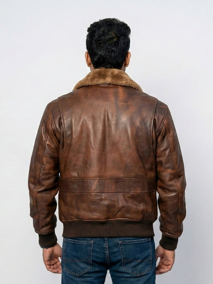 Man wearing a brown leather jacket with fur collar on a white background