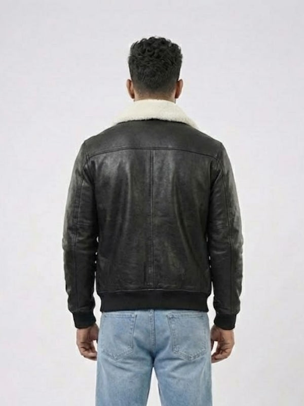 Person wearing a black leather jacket with white fur lining on a white background
