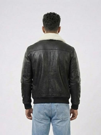 Person wearing a black leather jacket with white fur lining on a white background