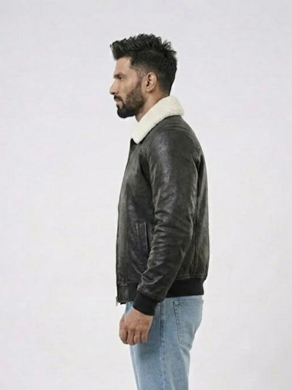 Man wearing a dark leather jacket with a white fur collar on a light gray background