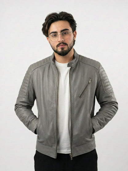 Man wearing a gray leather jacket on a white background