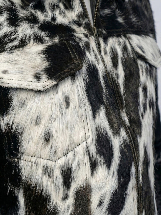 Close-up of a black and white patterned jacket with a zipper.