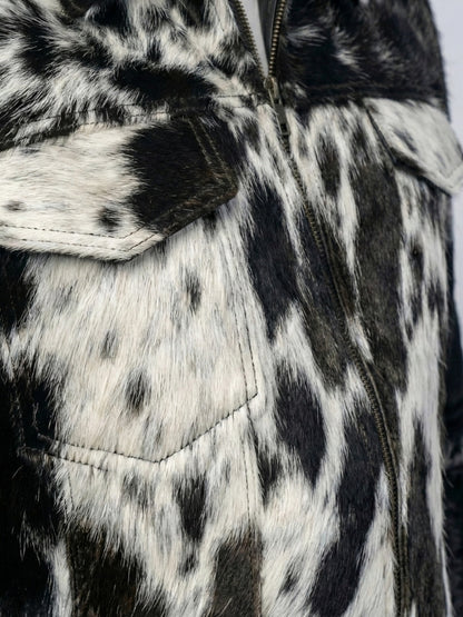 Close-up of a black and white patterned jacket with a zipper.