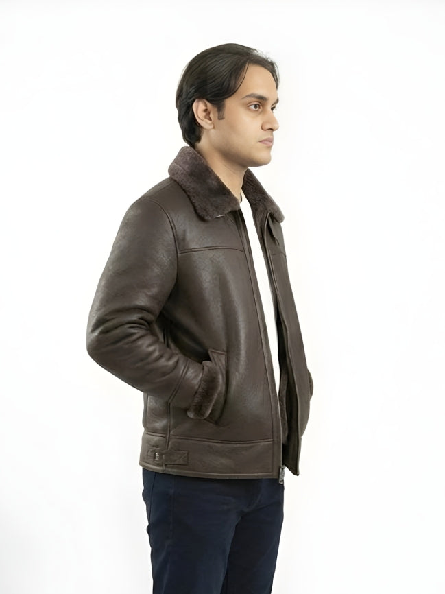Man wearing a brown leather jacket with fur collar on a white background