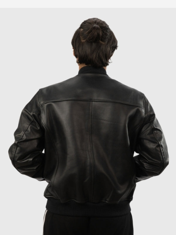 Person wearing a black leather jacket on a white background