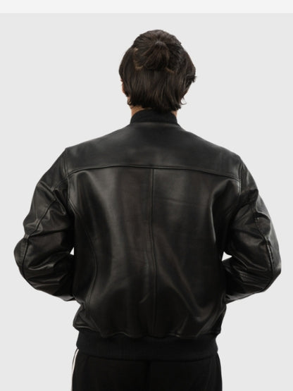 Person wearing a black leather jacket on a white background