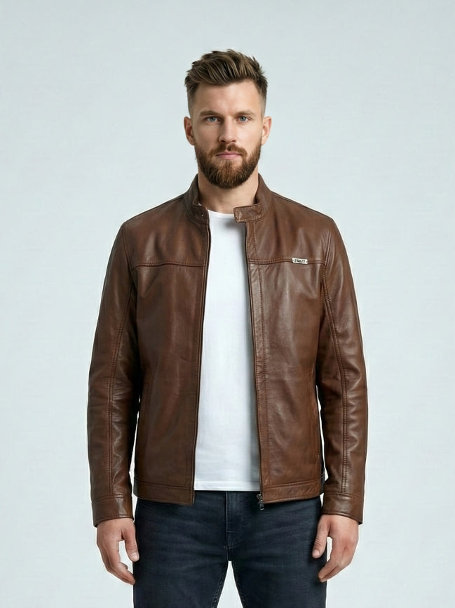 Man wearing a brown leather jacket on a light gray background