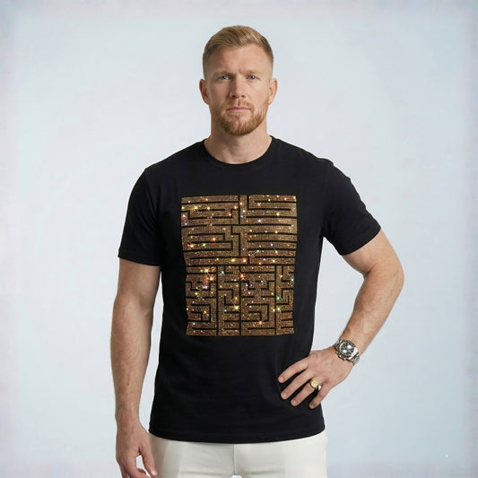 Man wearing a black t-shirt with a unique design on a plain background