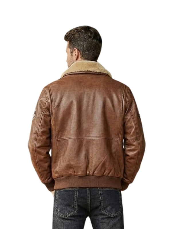 Man wearing a brown leather jacket with a shearling collar on a white background